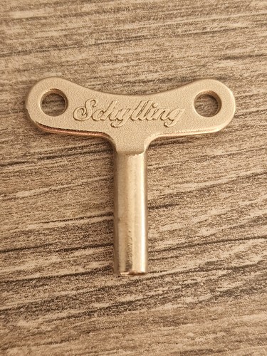 Schylling tin toy winding key - tin,